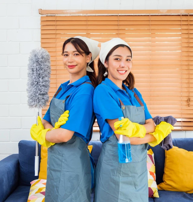 Professional cleaning team with equipment in office area